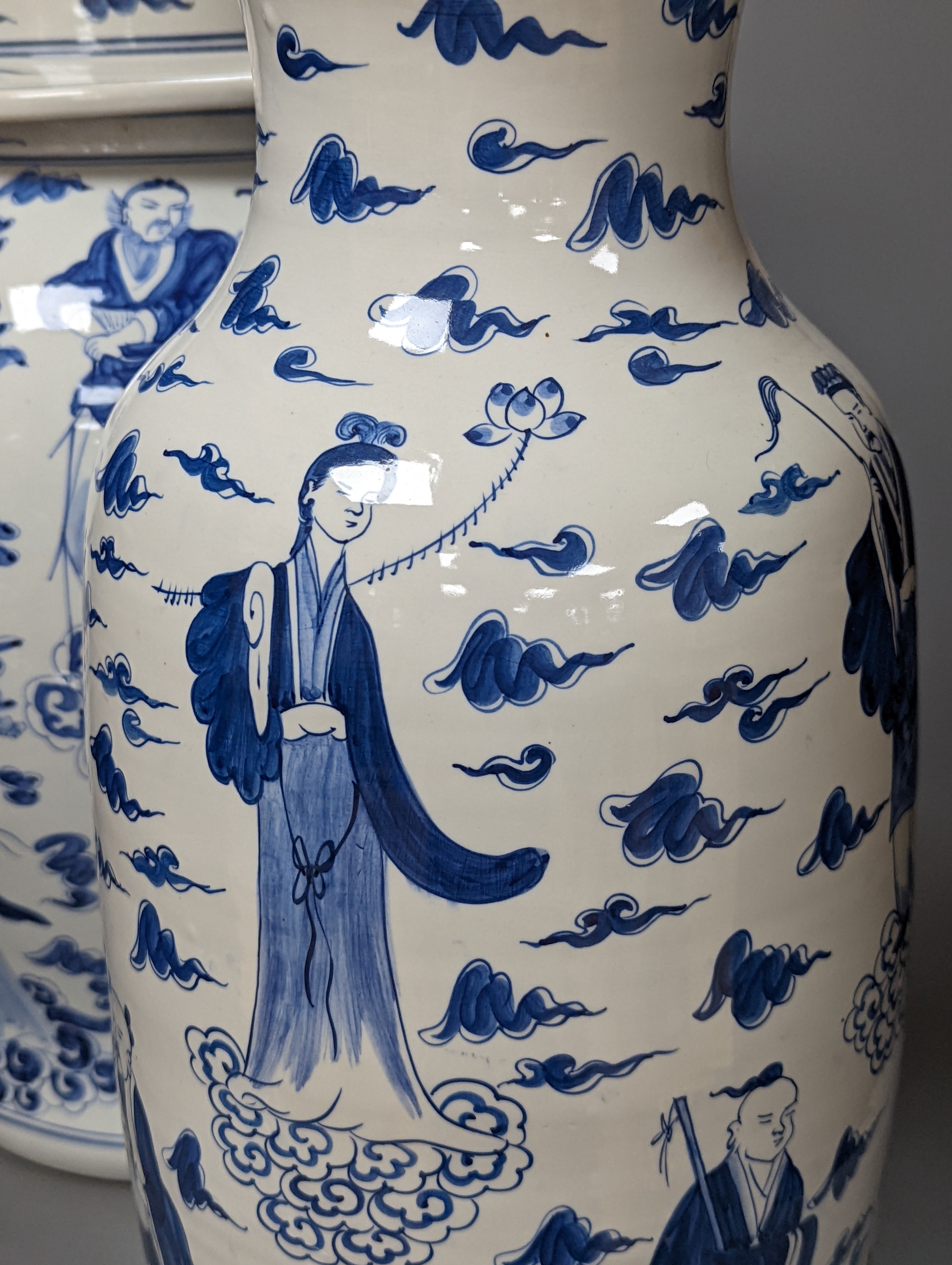 A large Chinese blue and white baluster jar and cover and matching vase, tallest 55 cms high.
